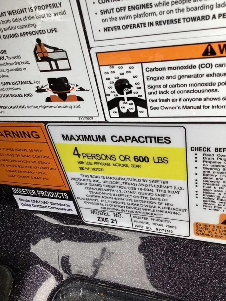Slide: The Image of Skeeter ZXE21 boat label with capacity and warnings, year 2026. - 40