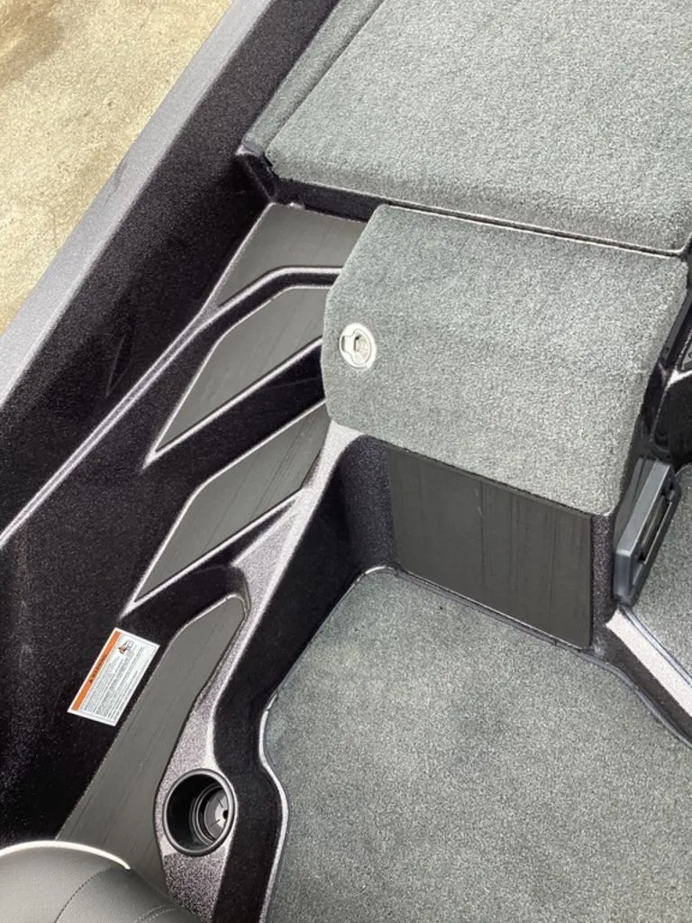 Slide: The Image of Interior of Skeeter ZXE21 boat, 2026 model, featuring grey carpet flooring. - 44