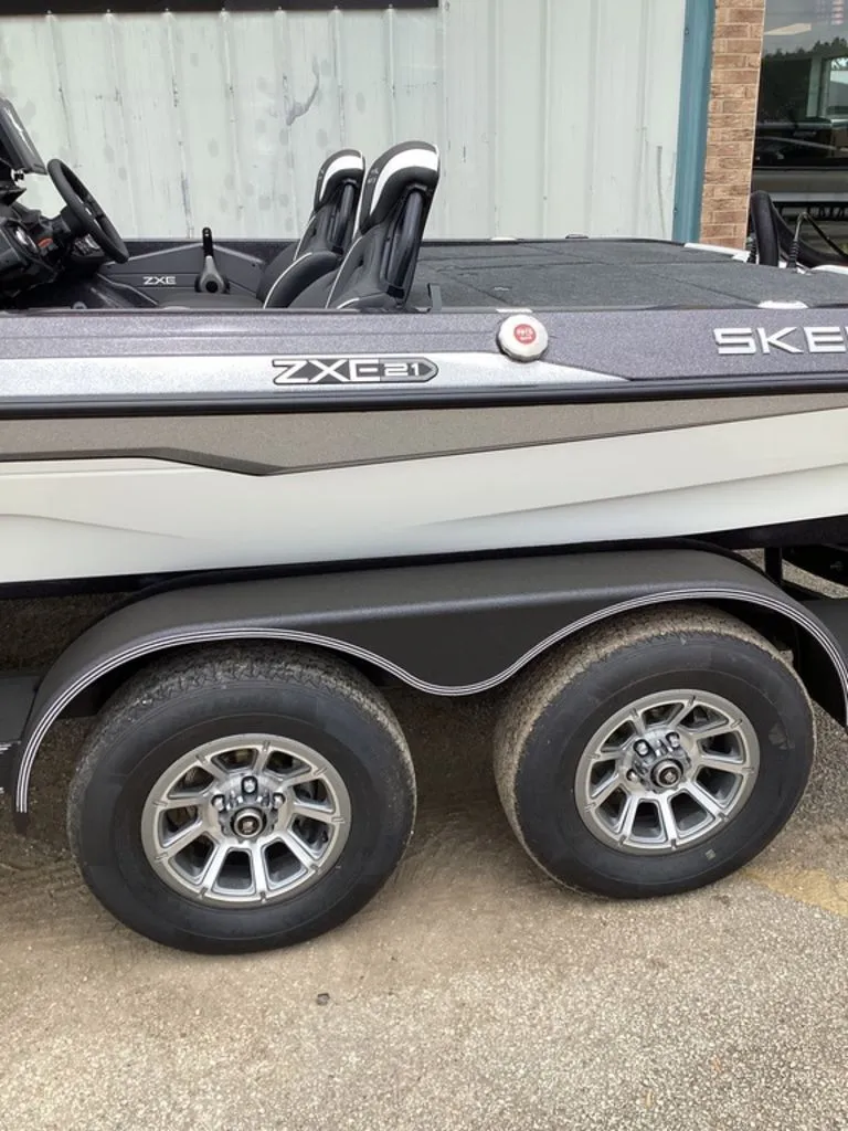 Slide: The Image of 2026 Skeeter ZXE21 boat on trailer with dual wheels. - 9