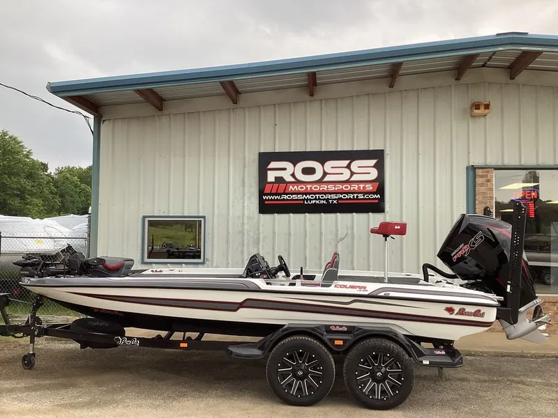 The Image of 2026 Bass Cat Cougar FTD SP boat at Ross Motorsports building. - 1