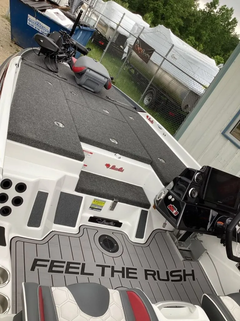 Slide: The Image of 2026 Bass Cat Cougar FTD SP boat with gray deck and helm console. - 12