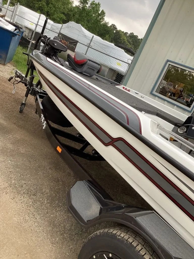 Slide: The Image of 2026 Bass Cat Cougar FTD SP boat on trailer. - 13
