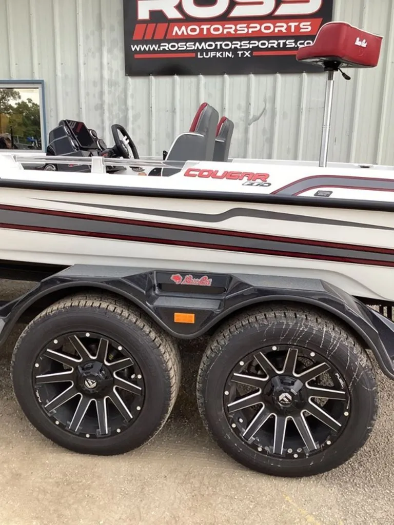 Slide: The Image of 2026 Bass Cat Cougar FTD SP boat with stylish wheels at Ross Motorsports. - 14