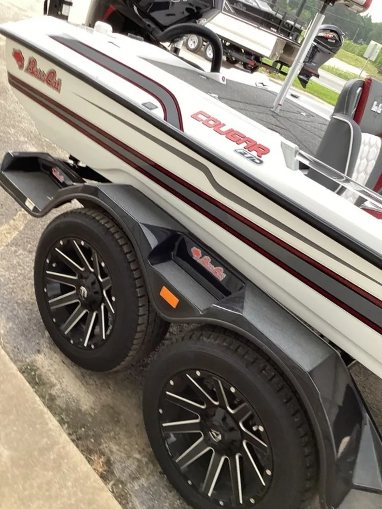 Slide: The Image of 2026 Bass Cat Cougar FTD SP boat on trailer with stylish wheels. - 23