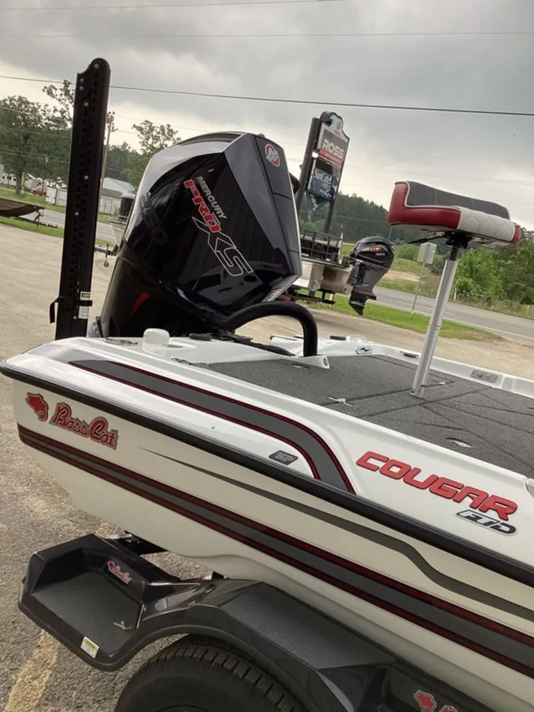 Slide: The Image of 2026 Bass Cat Cougar FTD SP boat with powerful outboard motor. - 24