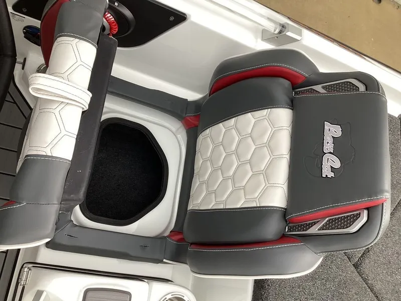Slide: The Image of 2026 Bass Cat Cougar FTD SP boat seat with gray and red design. - 35