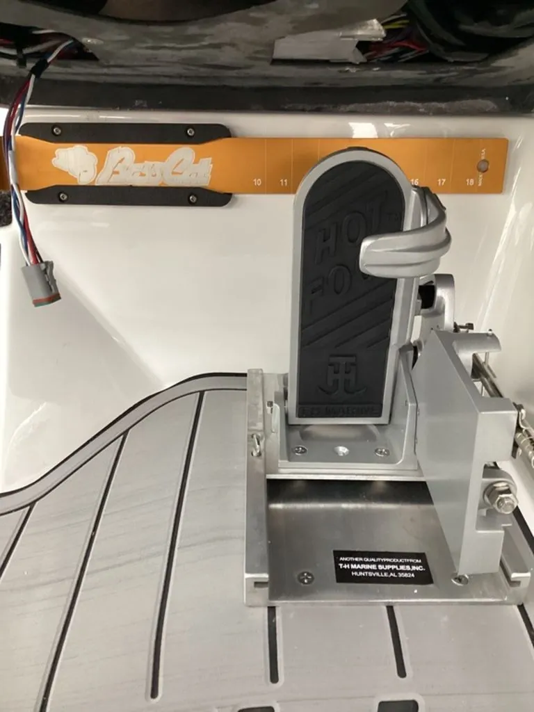 Slide: The Image of Bass Cat Cougar FTD SP 2026 boat pedal and measuring tape. - 45