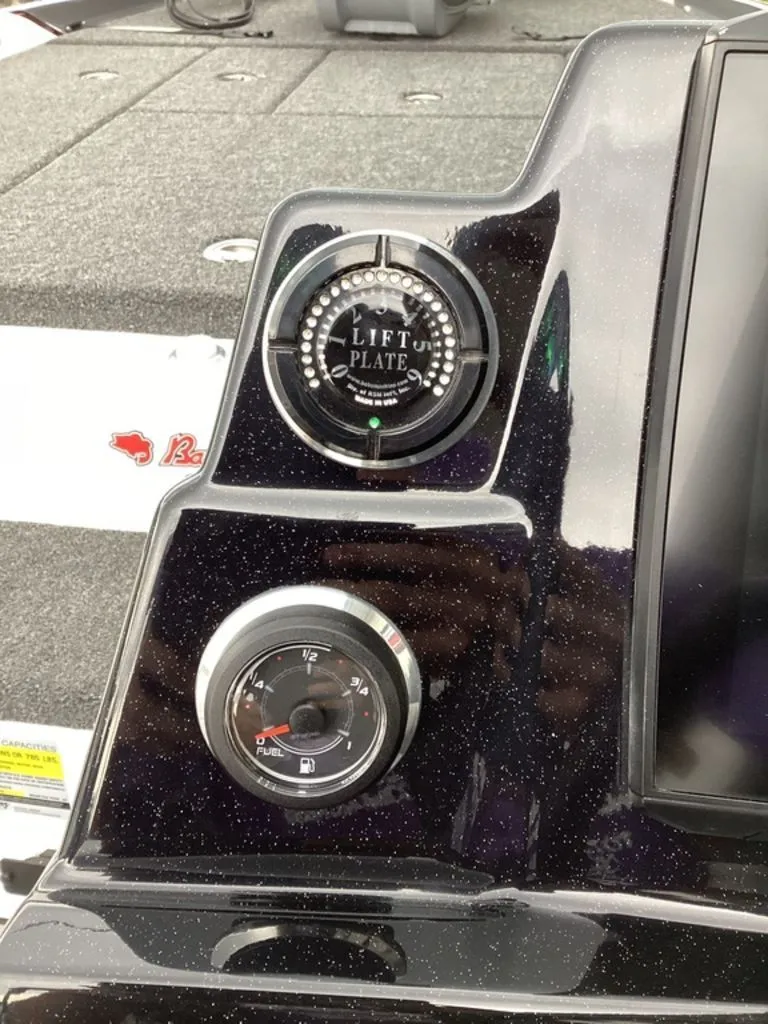 Slide: The Image of 2026 Bass Cat Cougar FTD SP dashboard with lift plate and fuel gauge. - 46