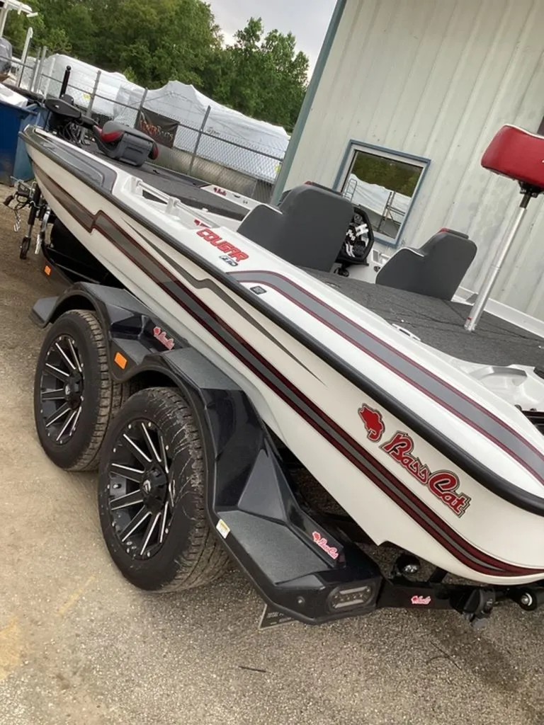 Slide: The Image of 2026 Bass Cat Cougar FTD SP boat parked on trailer. - 8