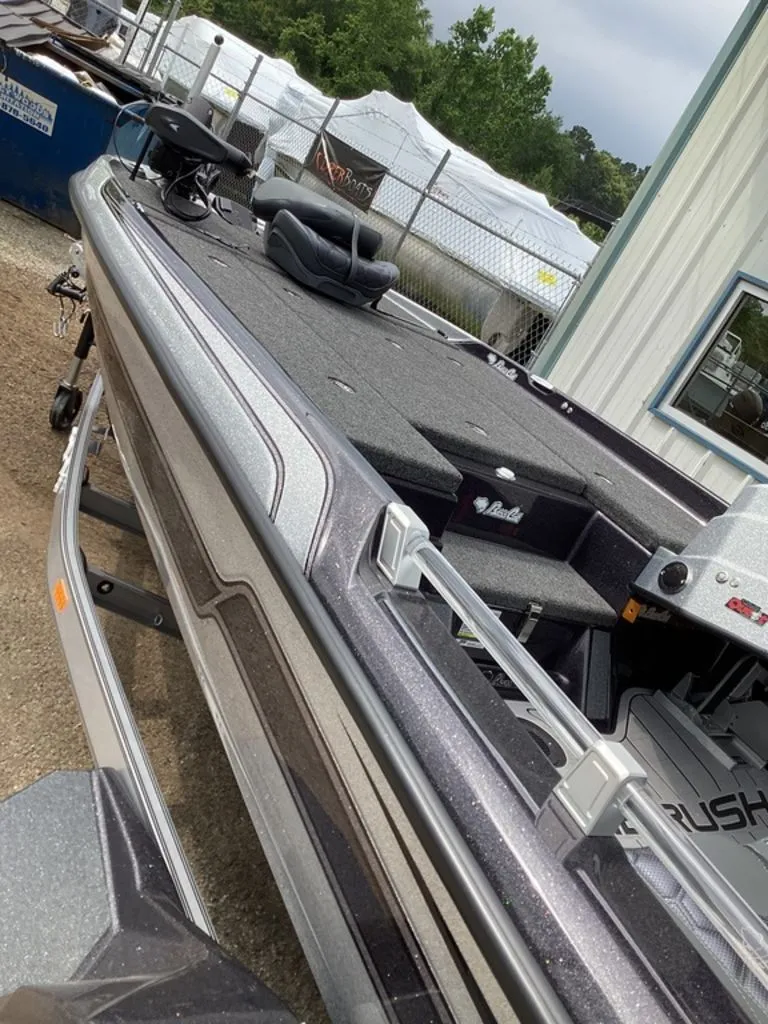 Slide: The Image of 2026 Bass Cat Cougar FTD SP boat on trailer, side view. - 14