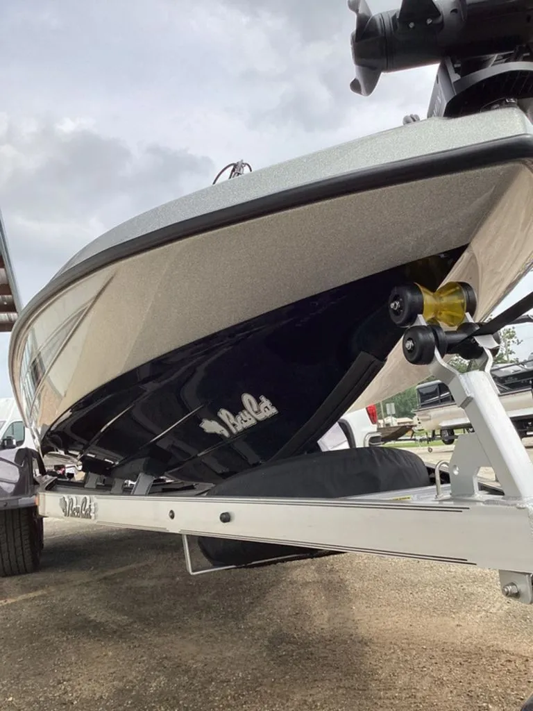 Slide: The Image of 2026 Bass Cat Cougar FTD SP boat on trailer, side view. - 19