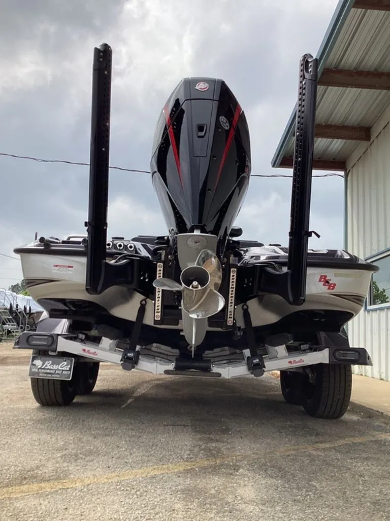 Slide: The Image of Rear view of a 2026 Bass Cat Cougar FTD SP boat with motor. - 2