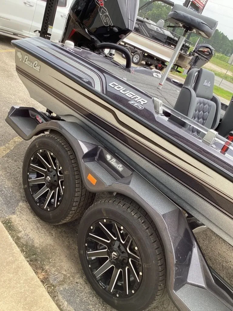 Slide: The Image of 2026 Bass Cat Cougar FTD SP boat on trailer with stylish wheels. - 24