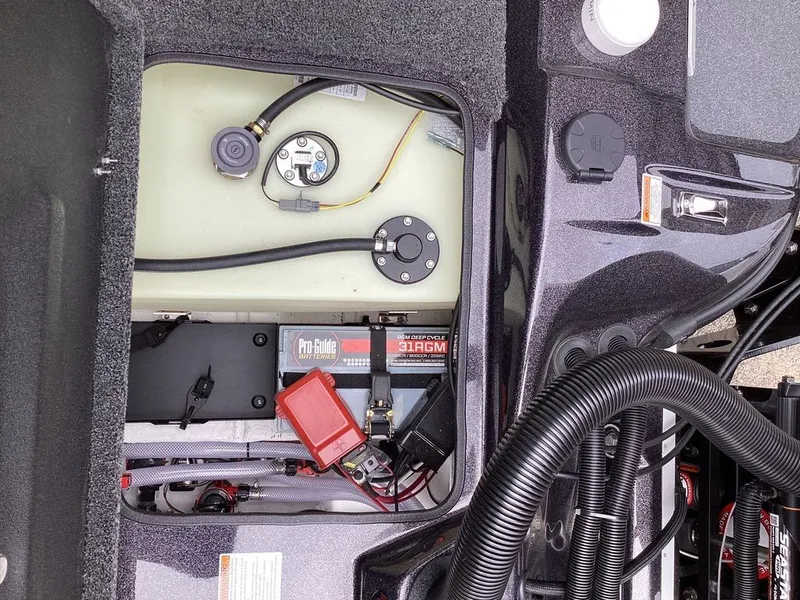 Slide: The Image of Interior view of 2026 Bass Cat Cougar FTD SP with battery and wiring. - 25