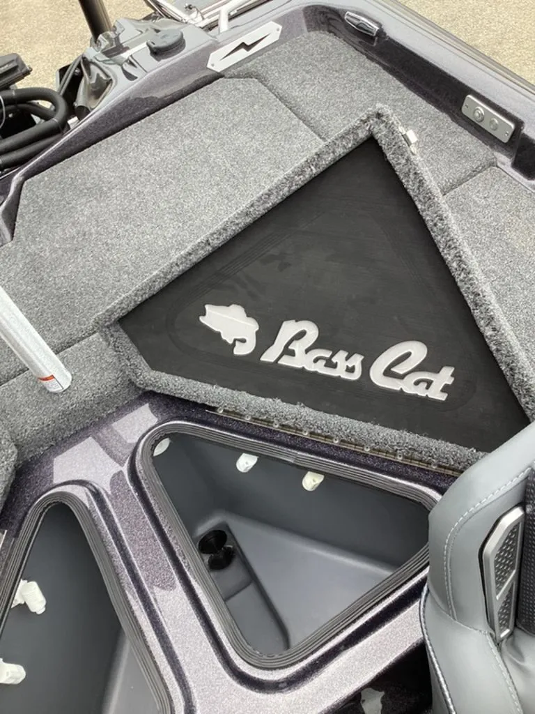 Slide: The Image of 2026 Bass Cat Cougar FTD SP boat interior with storage compartment. - 33