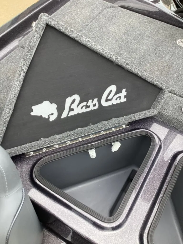 Slide: The Image of Bass Cat Cougar FTD SP 2026 boat compartment with logo. - 34