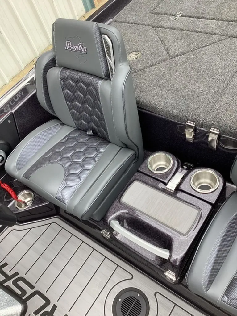 Slide: The Image of Interior of 2026 Bass Cat Cougar FTD SP with gray seats and cup holders. - 43