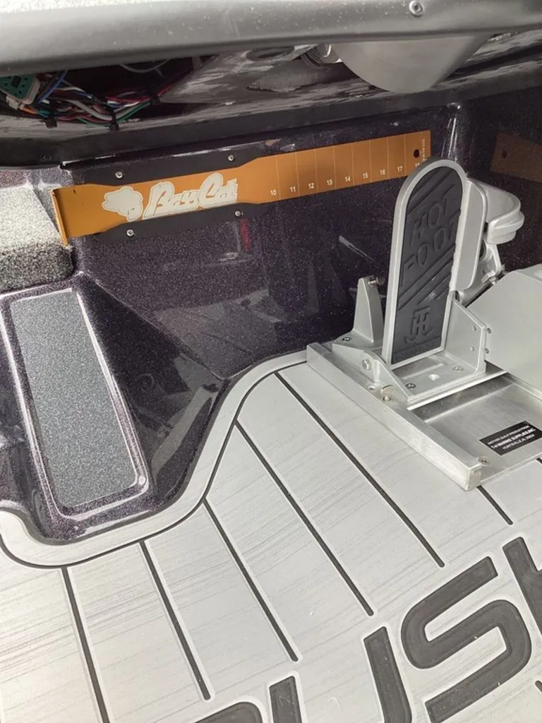 Slide: The Image of Interior of a 2026 Bass Cat Cougar FTD SP boat with foot pedal. - 46
