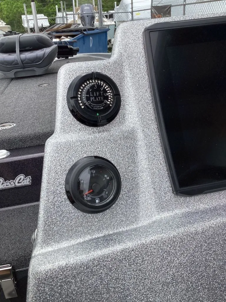 Slide: The Image of 2026 Bass Cat Cougar FTD SP dashboard with lift plate and fuel gauge. - 47