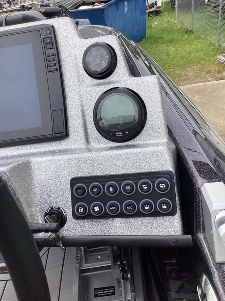 Slide: The Image of 2026 Bass Cat Cougar FTD SP dashboard with controls. - 49