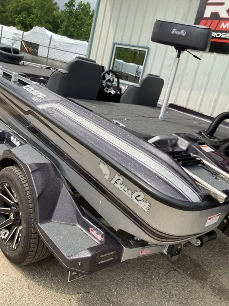 Slide: The Image of 2026 Bass Cat Cougar FTD SP boat on trailer, side view. - 7