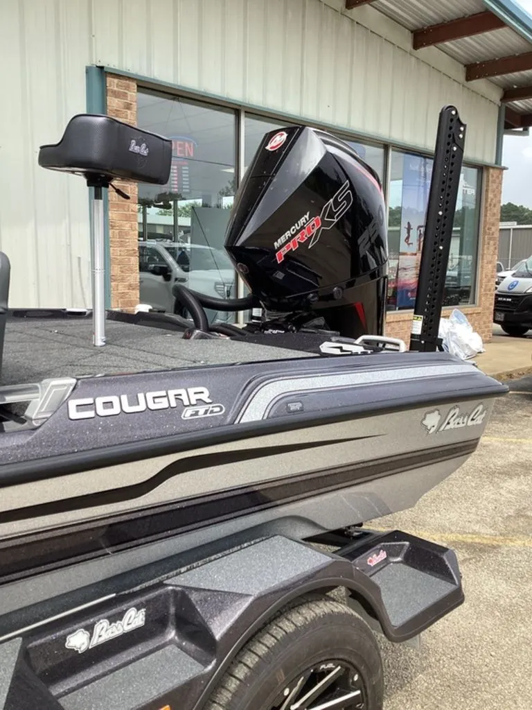 Slide: The Image of 2026 Bass Cat Cougar FTD SP with Mercury engine, side view. - 9