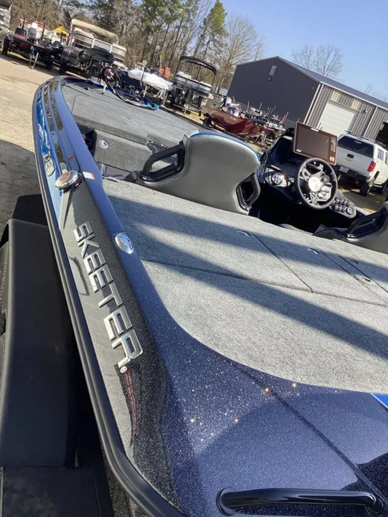 Slide: The Image of 2026 Skeeter ZXE21 boat on a lot, close-up of deck. - 13