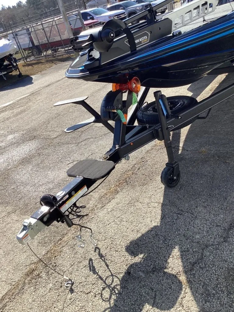 Slide: The Image of Skeeter ZXE21 boat trailer, 2026 model, parked outdoors. - 19