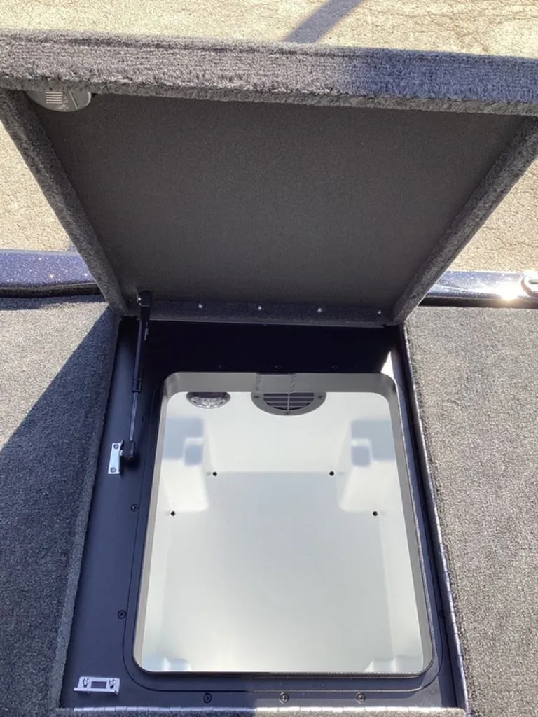 Slide: The Image of Open storage compartment in Skeeter ZXE21 boat, model 2026. - 28