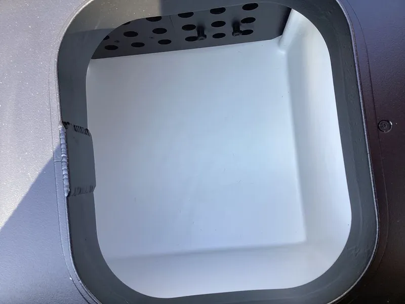 Slide: The Image of Interior of a 2026 Skeeter ZXE21 boat compartment. - 29