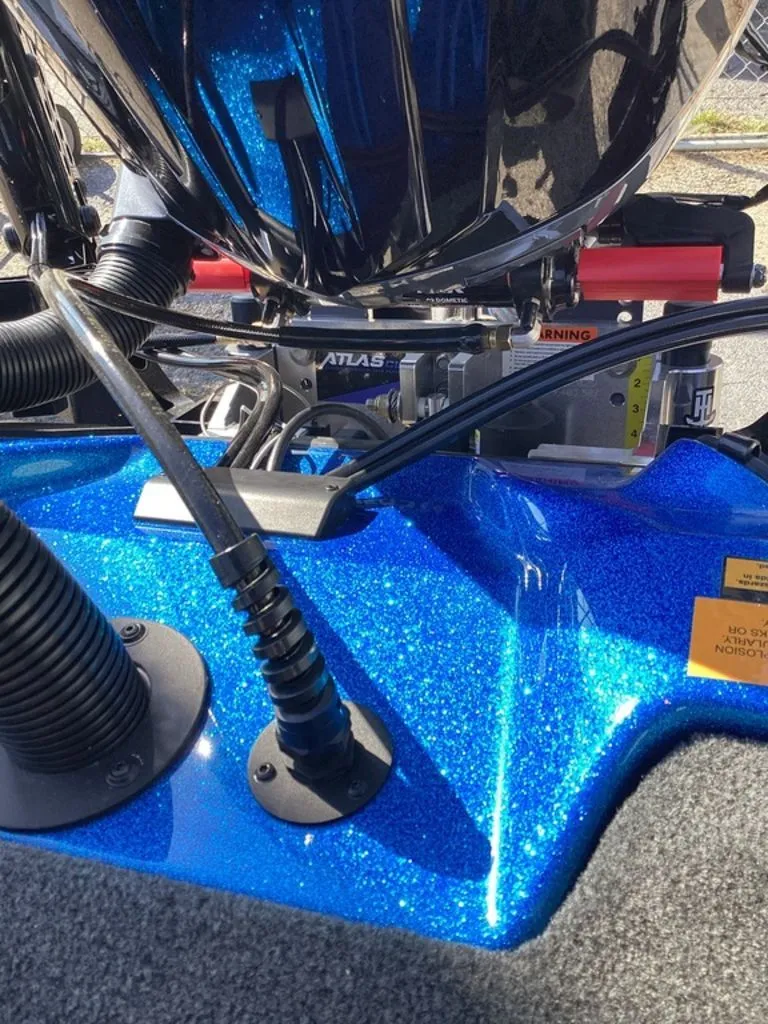 Slide: The Image of Close-up of a blue Skeeter ZXE21 boat stern, model year 2026. - 32