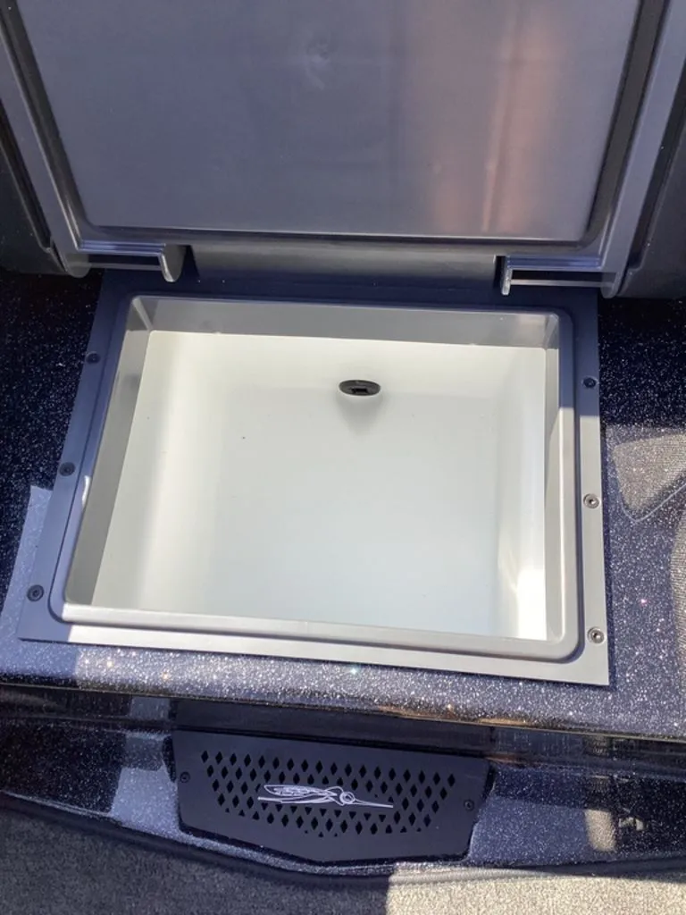 Slide: The Image of Open storage compartment in 2026 Skeeter ZXE21 boat. - 33