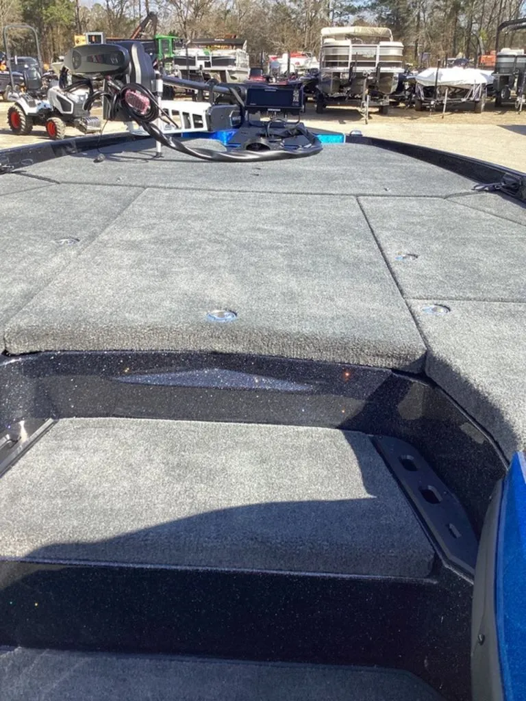 Slide: The Image of 2026 Skeeter ZXE21 boat with gray deck and equipment. - 42