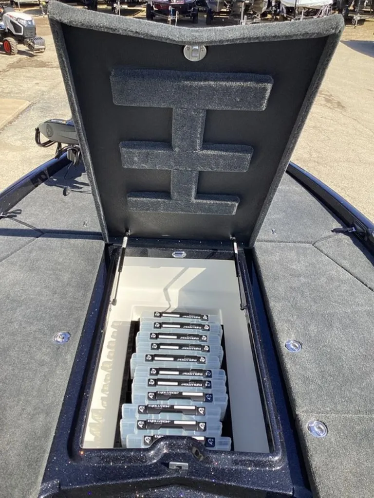 Slide: The Image of Skeeter ZXE21 2026 boat with open storage hatch and batteries. - 44