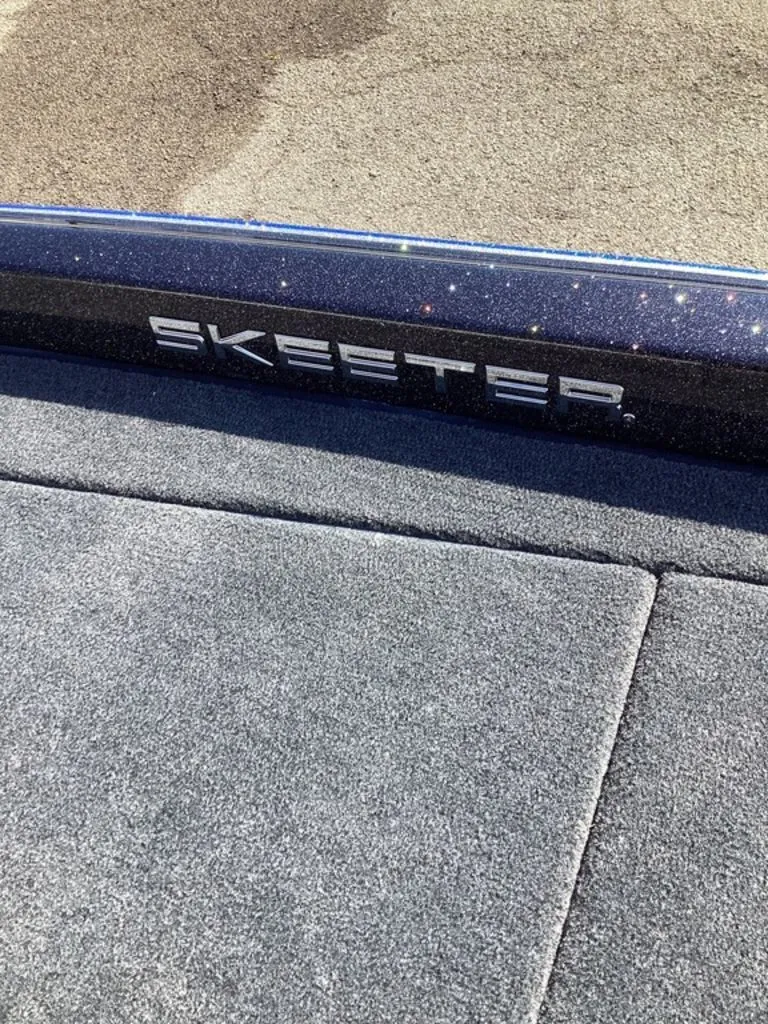 Slide: The Image of Skeeter ZXE21 2026 boat with gray carpet flooring. - 45