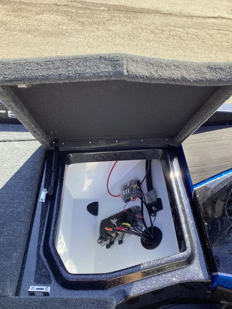 Slide: The Image of Open storage compartment of a 2026 Skeeter ZXE21 boat. - 46