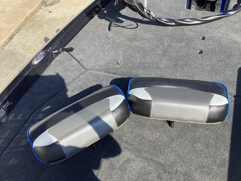 Slide: The Image of Skeeter ZXE21 2026 boat seats on gray carpeted floor. - 48