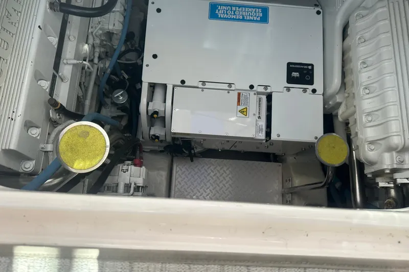Slide: The Image of Engine compartment of a 2011 Tiara Yachts 4300 Open, showcasing mechanical components. - 10