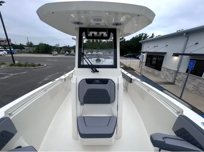 Slide: The Image of Interior view of 2026 Cobia 245CC boat at the dock. - 11