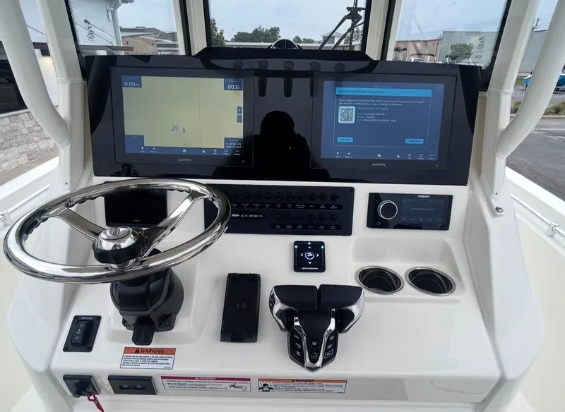 Slide: The Image of Cobia 245CC 2026 helm with advanced navigation systems. - 14