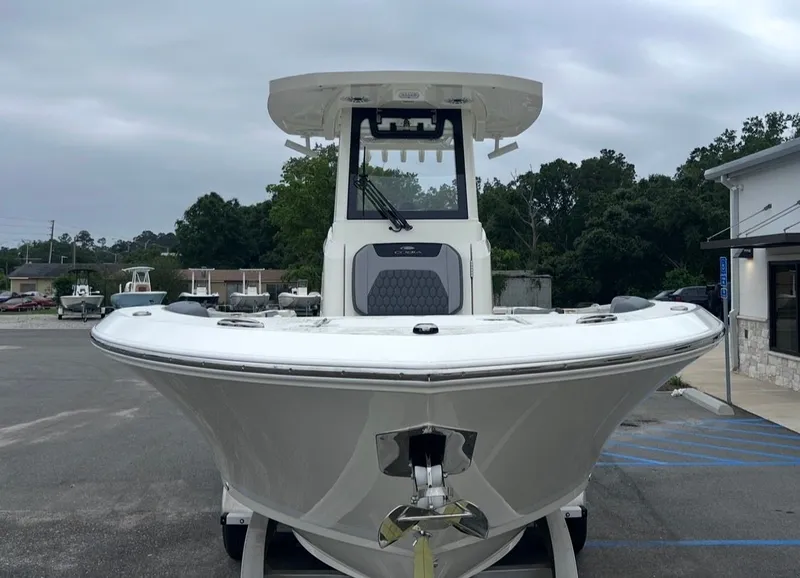 Slide: The Image of 2026 Cobia 245CC boat on parking lot, front view. - 8