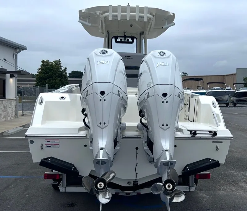Slide: The Image of 2026 Cobia 245CC boat with dual outboard engines. - 9