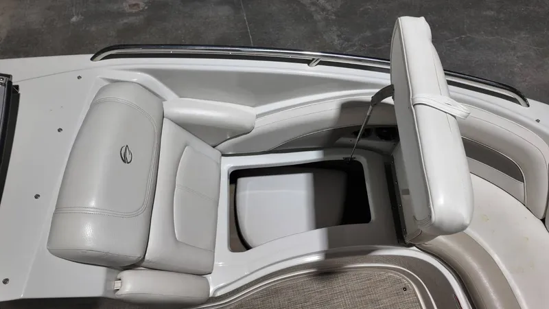 Slide: The Image of Interior of a 2007 Crownline 240 LS boat with seating and storage. - 10