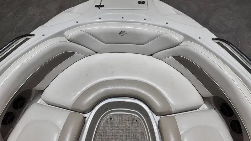 Slide: The Image of Interior of a 2007 Crownline 240 LS boat, white and gray upholstery. - 11