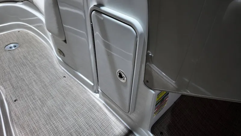 Slide: The Image of Interior of a 2007 Crownline 240 LS with gray flooring. - 15
