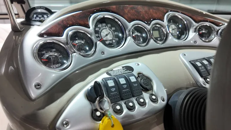 Slide: The Image of Dashboard of a 2007 Crownline 240 LS boat with gauges. - 20