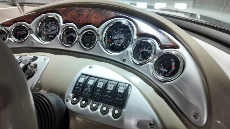 Slide: The Image of Dashboard of a 2007 Crownline 240 LS boat with gauges. - 21