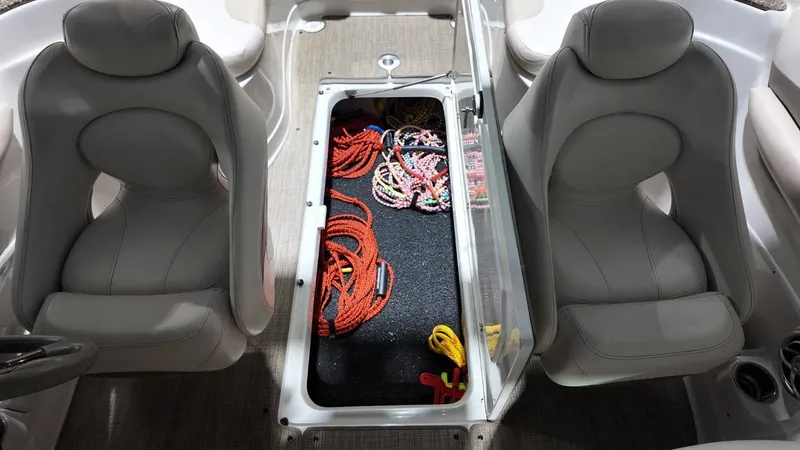 Slide: The Image of Interior of 2007 Crownline 240 LS with storage and ropes. - 24