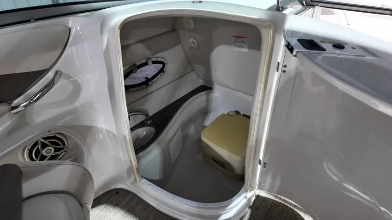 Slide: The Image of Interior of 2007 Crownline 240 LS with toilet and sink. - 27
