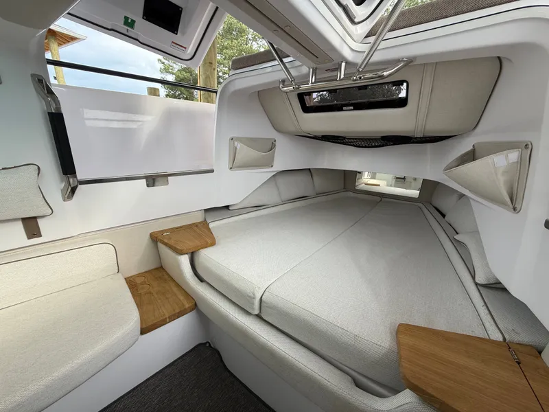 Slide: The Image of Interior of 2025 Axopar 37 XC Cross Cabin with cozy bed. - 10